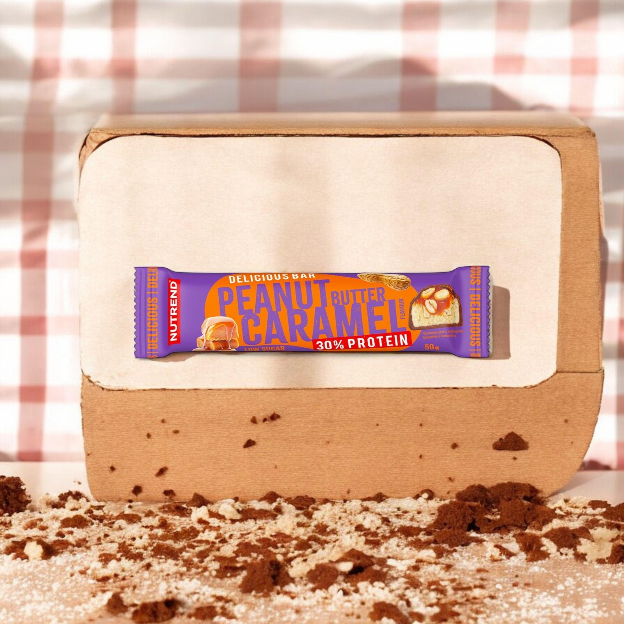 NUTREND Delicious Bar Protein 30 % – 50 g – Masło Orzechowe Karmel - WYPRZEDAŻ -15-05